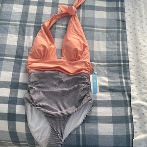 Brand new one piece , tags on still, coral and striped , high cut sides , small